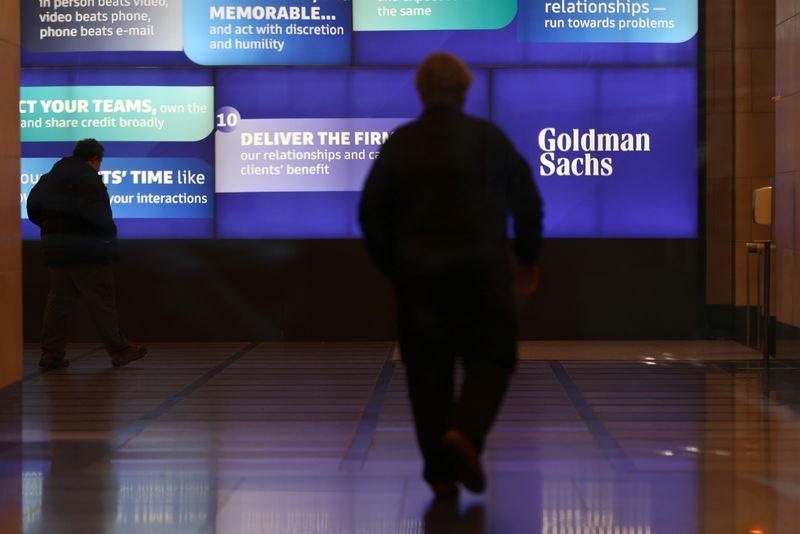 People walk in the Goldman Sachs global headquarters in Manhattan,