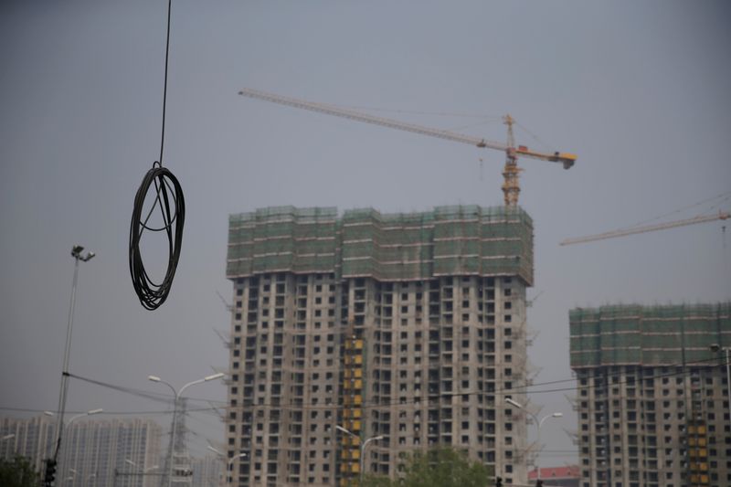 A cable is seen near residential buildings under construction in