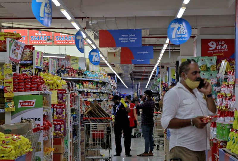 FILE PHOTO: Customers buy grocery items inside a superstore of