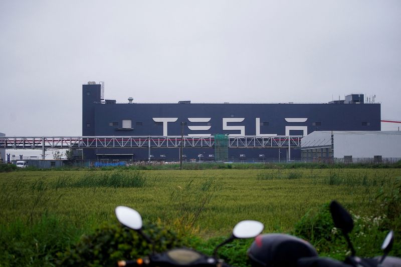 FILE PHOTO: A Tesla sign is seen at its factory