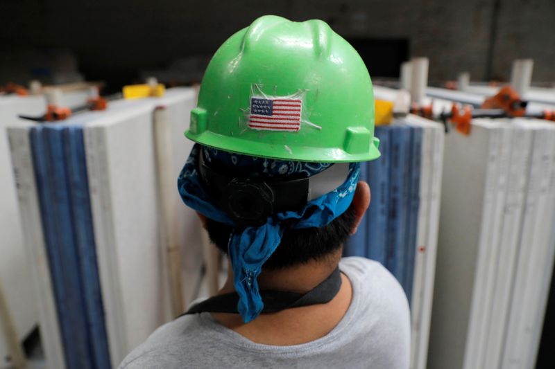A U.S. flag is seen on the hard hat of