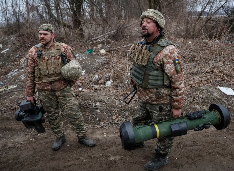 FILE PHOTO: Ukrainian service members hold a Javelin missile system