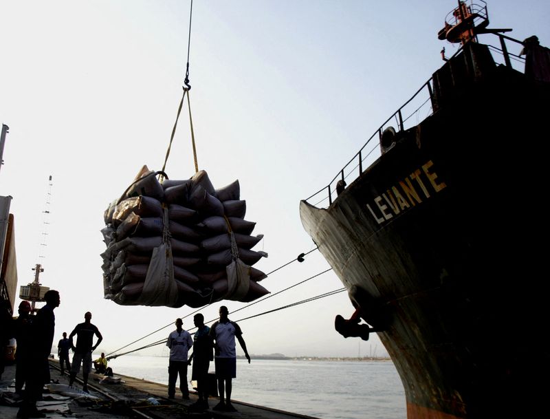 FILE PHOTO: A ship is loaded with sugar sacks on