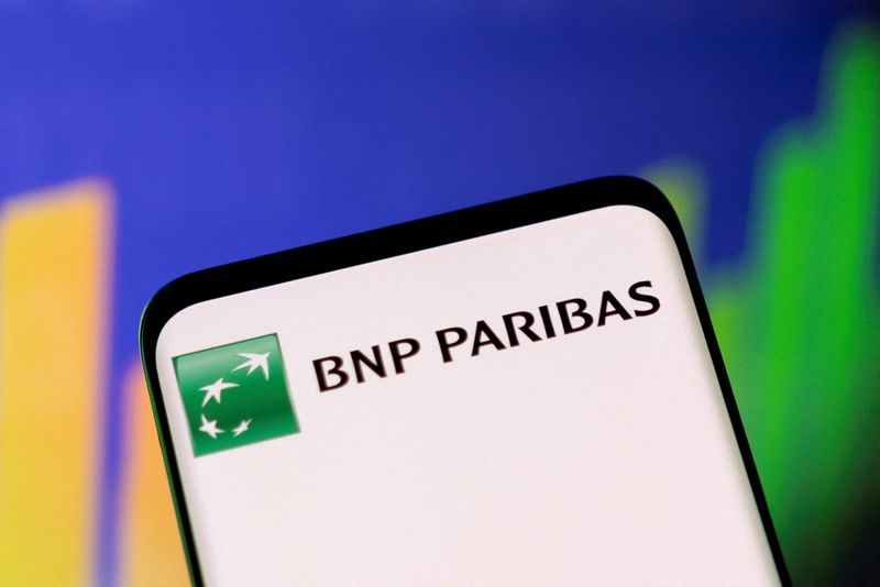 FILE PHOTO: Illustration shows BNP Paribas logo and stock graph