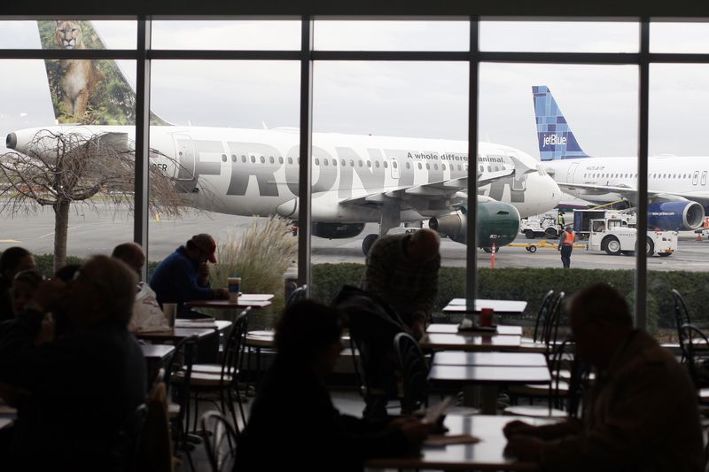 A Frontier Airlines plane is seen at LaGuardia Airport in