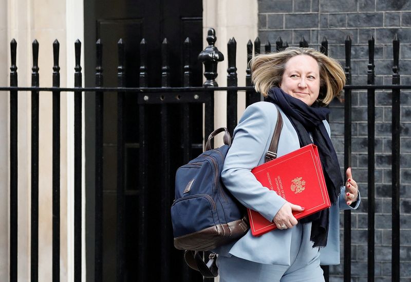 FILE PHOTO: British International Trade Secretary Anne-Marie Trevelyan walks outside
