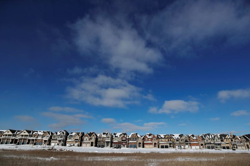 FILE PHOTO: A row of houses stand in a newly