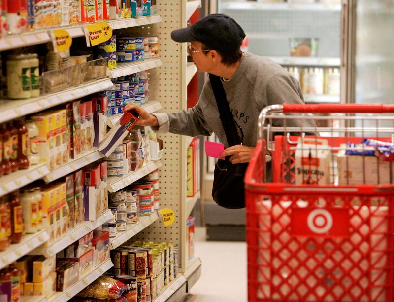 FILE PHOTO: A shopper looks at grocery items at a