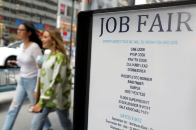 FILE PHOTO: Signage for a job fair is seen on
