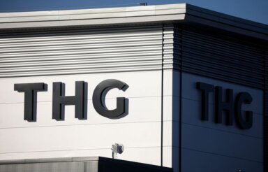Signage is seen on a THG office building in Manchester