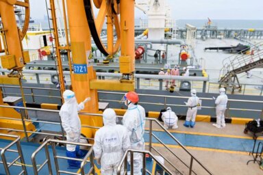 Immigration inspection officers check a tanker carrying imported crude oil