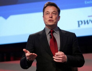 FILE PHOTO: Elon Musk talks at the Automotive World News