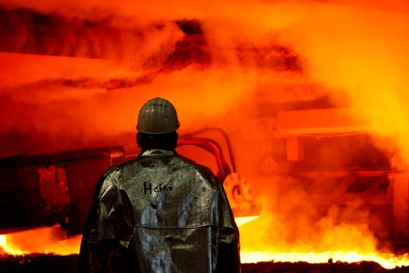 FILE PHOTO: A worker of German steelmaker ThyssenKrupp controls a