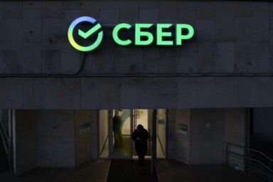 The logo is on display in an office of Sberbank