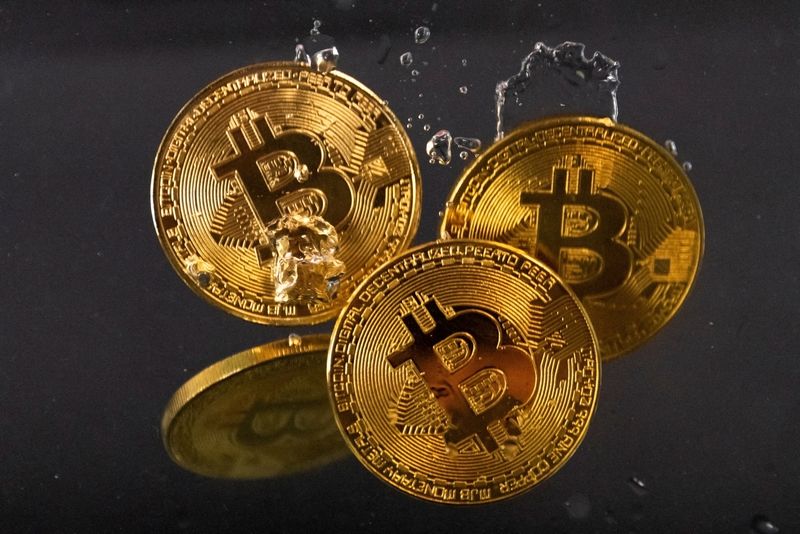 FILE PHOTO: Illustration shows representation of cryptocurrency Bitcoin plunge into