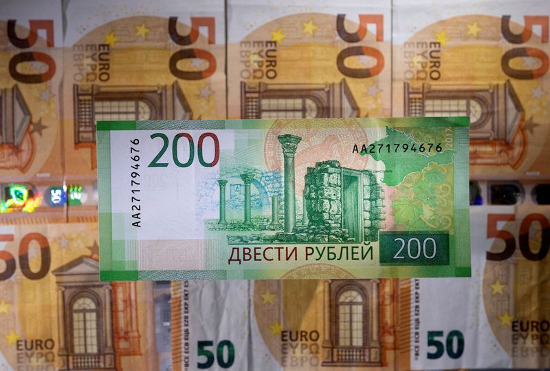 FILE PHOTO: Illustration shows a Russian rouble banknote placed on