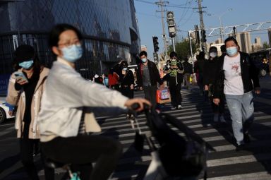 People wearing face masks to prevent the spread of the