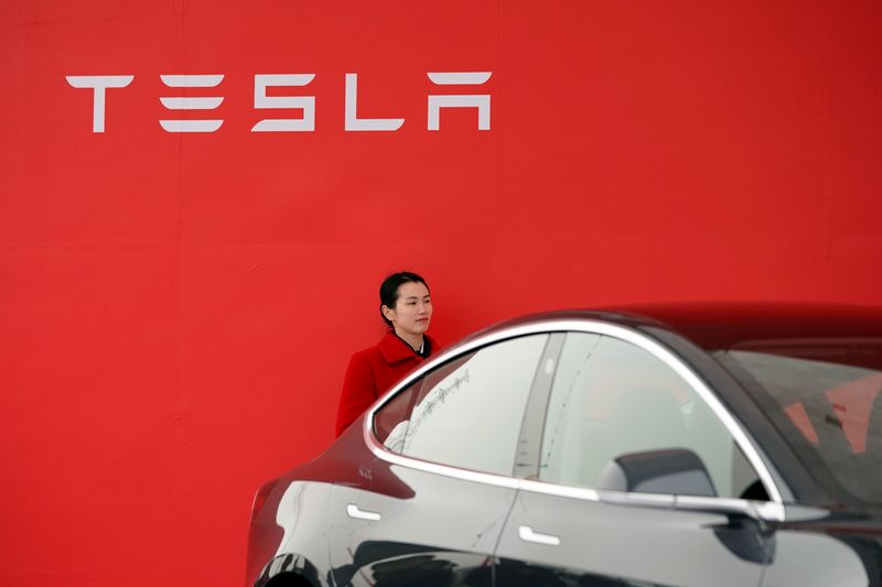 A Tesla logo is seen at a groundbreaking ceremony of