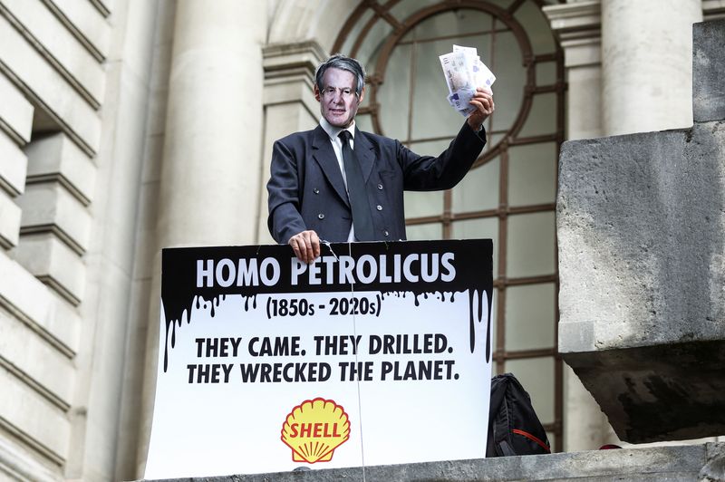 Climate activists stage a protest as Shell holds annual shareholder