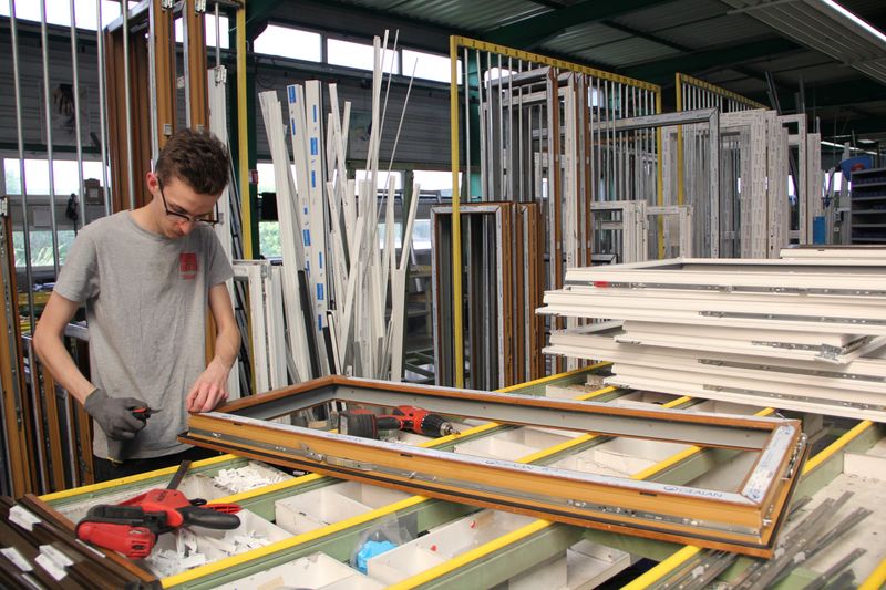 Workers at French window-maker sacrifice perks for pay increases