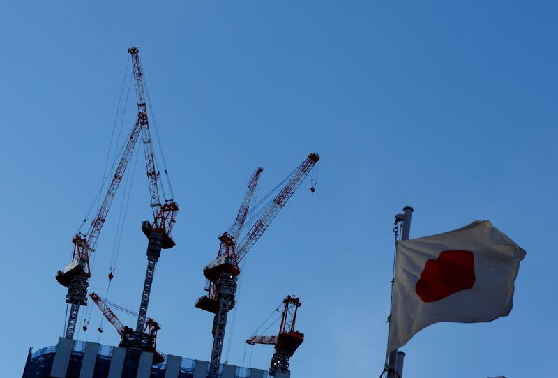 FILE PHOTO: Japan’s national flag flutters in front of a