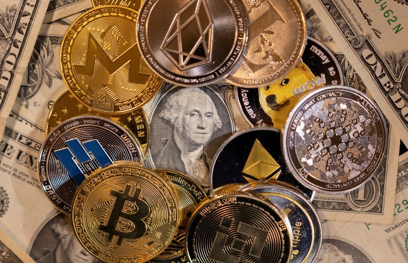 FILE PHOTO: IIlustration shows representations of virtual cryptocurrencies on U.S.