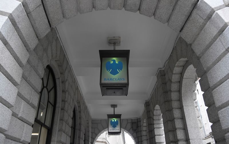 The logo of Barclays bank is seen on glass lamps