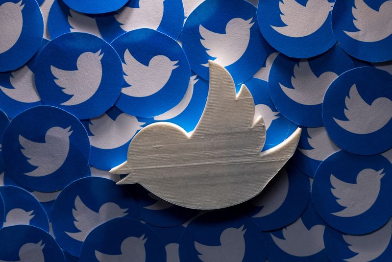 FILE PHOTO: Illustration shows printed Twitter logos