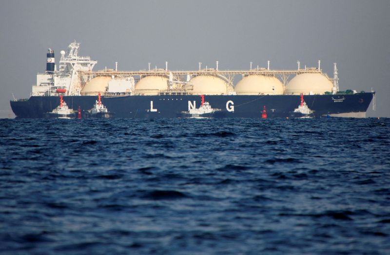 FILE PHOTO: A LNG tanker is tugged towards a thermal