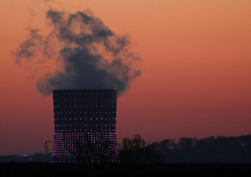 Smoke billows from a chimney at a combined-cycle gas turbine