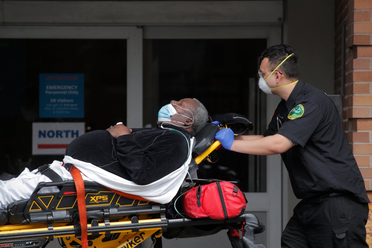 Paramedics take a patient into emergency center at Maimonides Medical