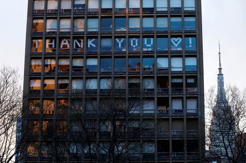 “Thank You” spelled in building windows during outbreak of coronavirus