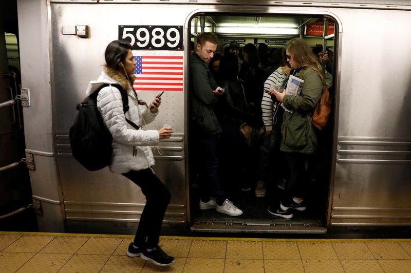 FILE PHOTO: Passengers wait inside a stopped C subway train