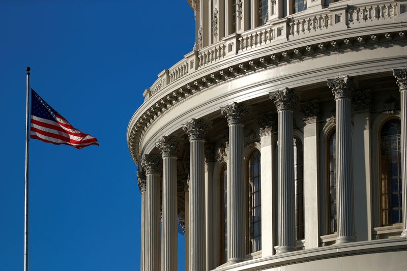 A U.S. flag flies outside of the Capitol dome ahead