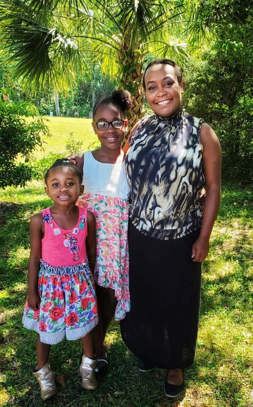 Shana Swain poses with her daughters, in Charleston, South Carolina