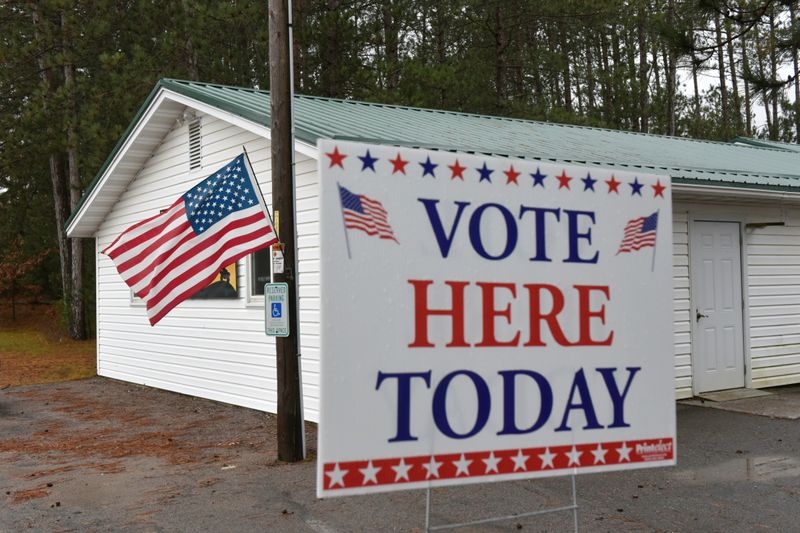 Voting sign is seen outside The Rock Dam Rod and