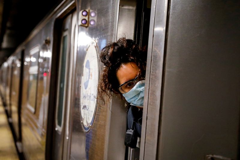FILE PHOTO: A conductor looks out of an MTA subway