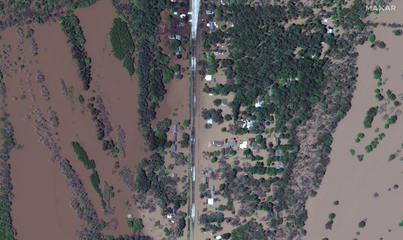 A satellite image shows the flooded Isabella Street and homes