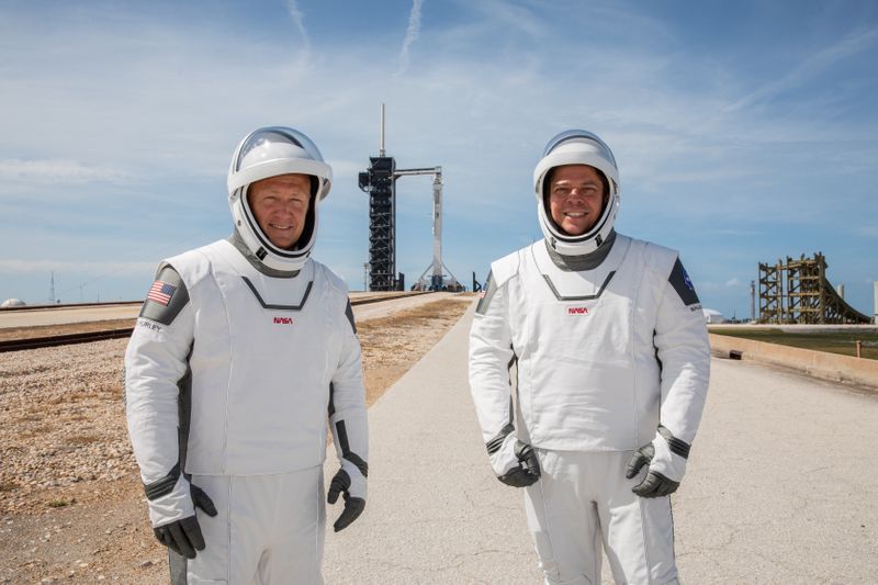 NASA astronauts Douglas Hurley and Robert Behnken participate in a