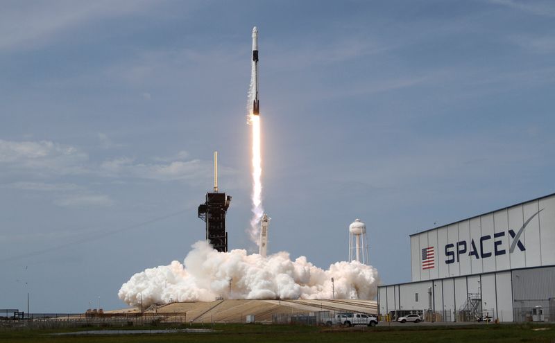 A SpaceX Falcon 9 rocket and Crew Dragon spacecraft carrying