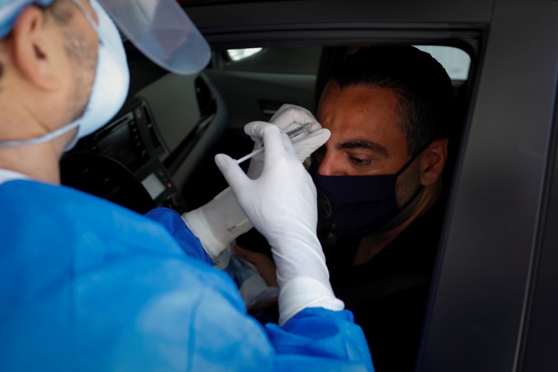 FILE PHOTO:  A plastic surgeon conducts drive-through Botox injections