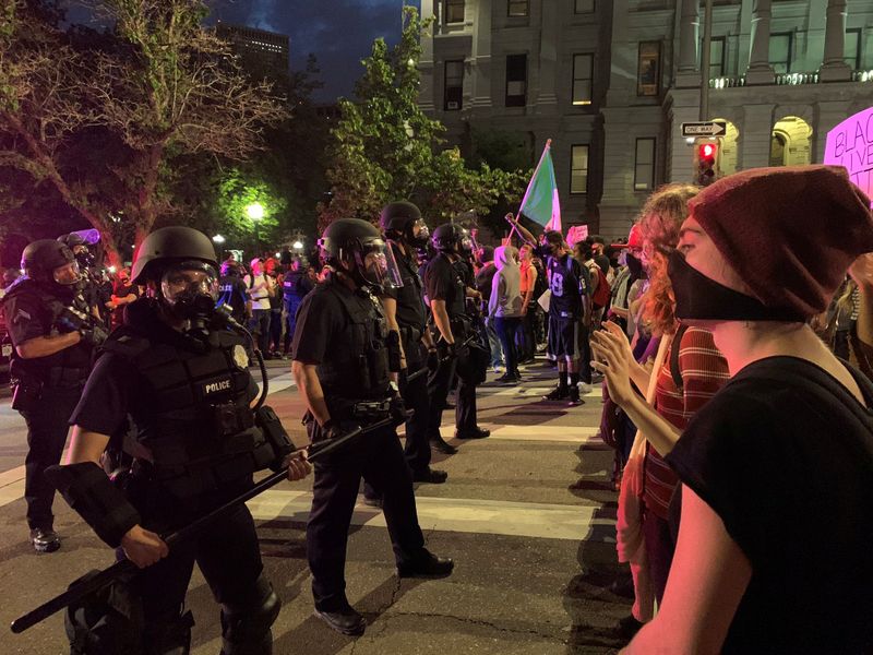 FILE PHOTO: Demonstrators face off with police near Capitol building