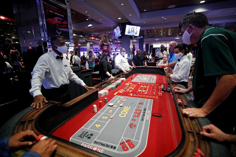 FILE PHOTO: Gamblers play at a craps table during the