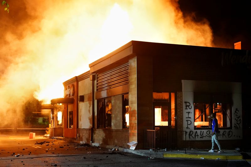 FILE PHOTO: A Wendy’s burns following a rally against racial