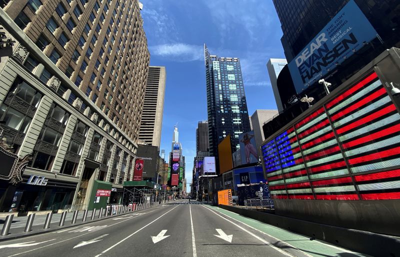 A nearly deserted 7th Avenue in Times Square is seen