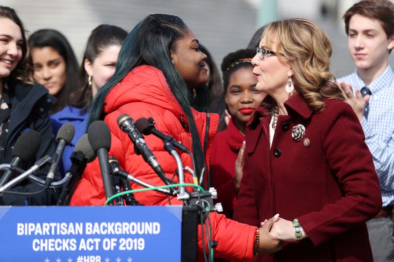 FILE PHOTO: U.S. former Representative Giffords embraces student activist Wright