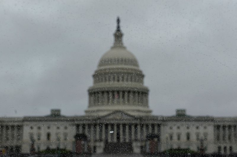 The U.S. Capitol Hill building is seen through rain drops