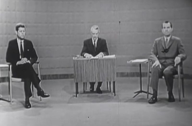 Senator John F. Kennedy and Vice President Richard Nixon sit
