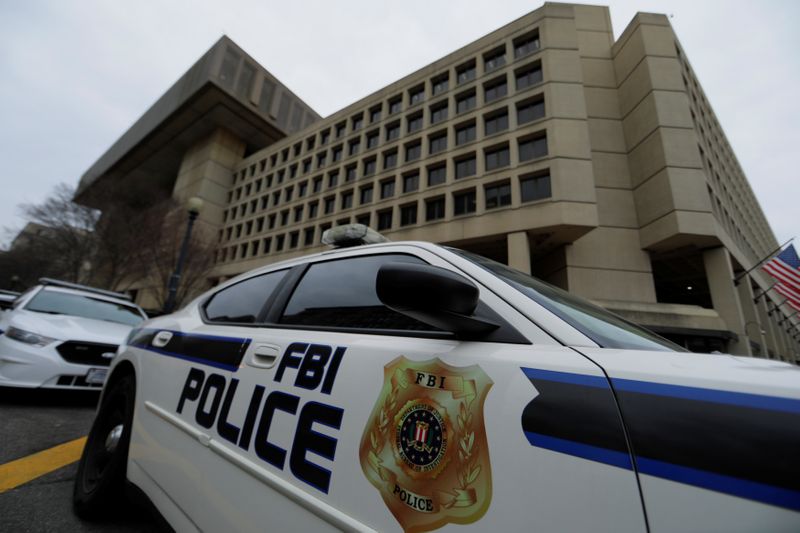 FILE PHOTO: FBI police vehicles sit outside FBI building in
