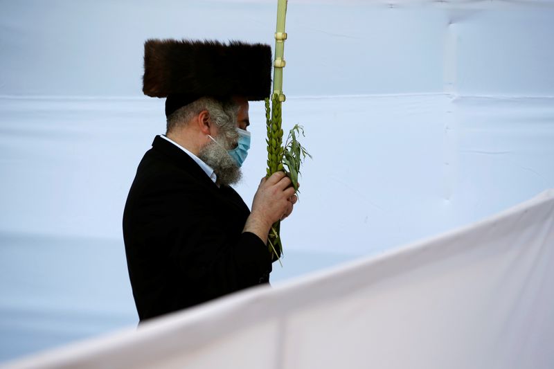 Jewish worshippers take part in the priestly blessing on Sukkot